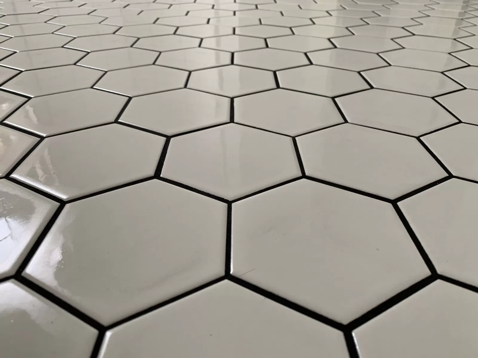 White hexagon tile with dark contrasting joints