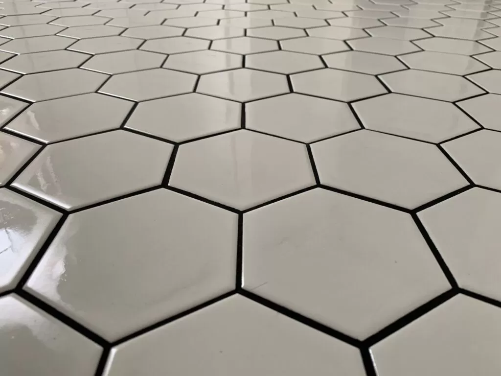 White hexagon tile with dark contrasting joints